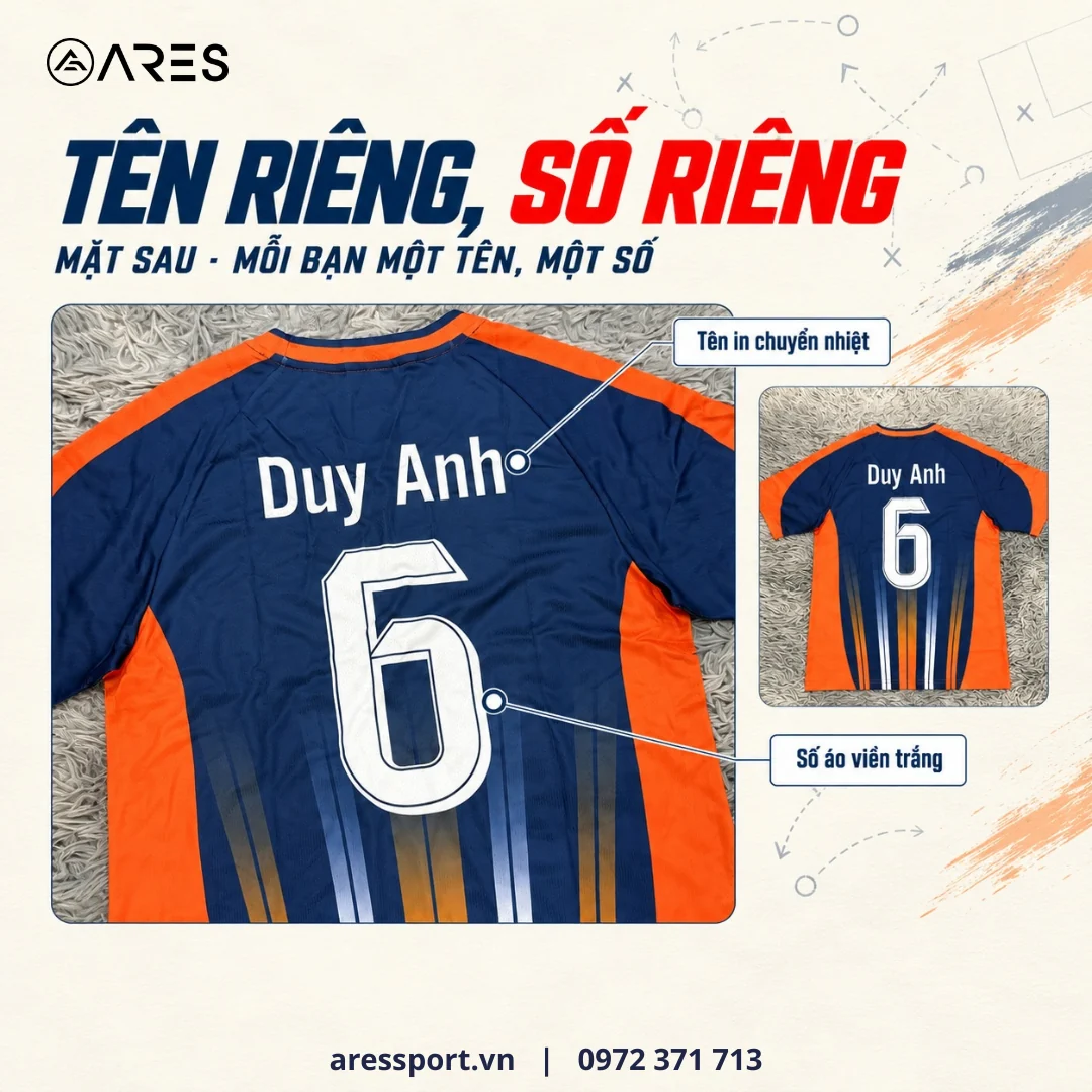 Lưng áo bóng đá TIS màu navy cam in tên riêng Duy Anh phía trên số 6 viền trắng